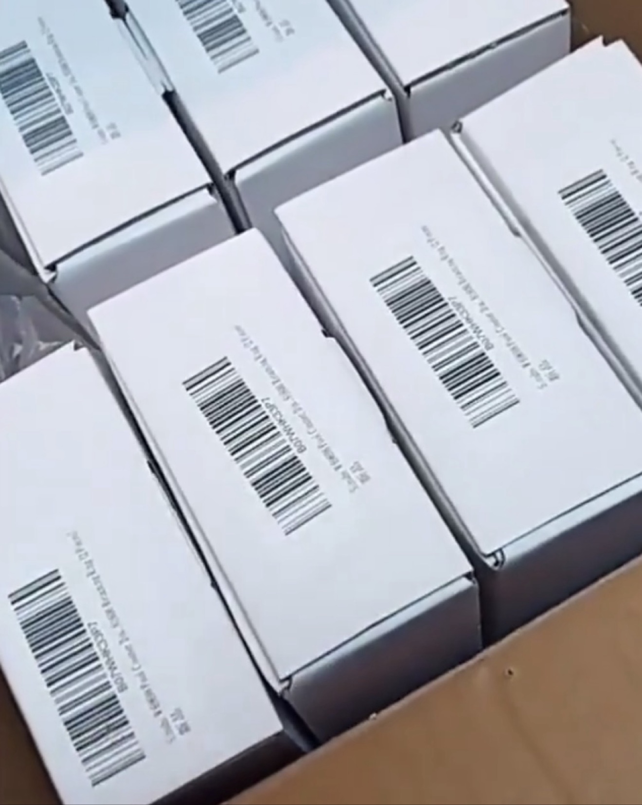 White retail boxes, barcoded and ready to pack