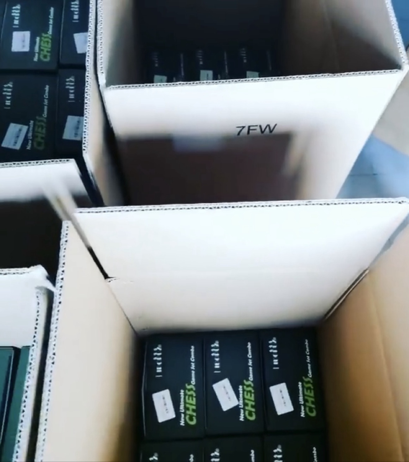 Black combo boxes being packed into cartons